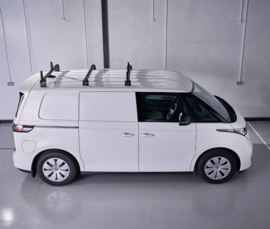 Black ULTI Bar roof bars fitted to a white van side view